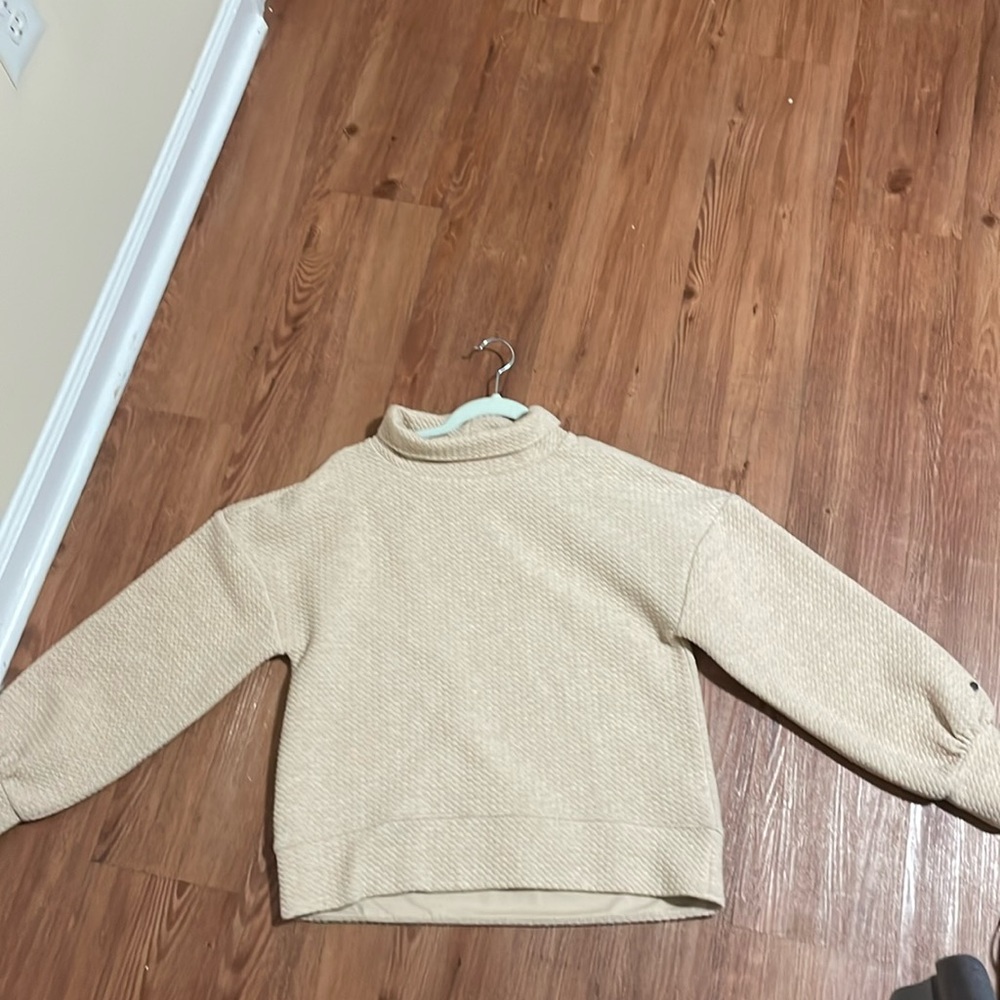 Small beige-colored long sleeve, CALIA by Carrie Underwood